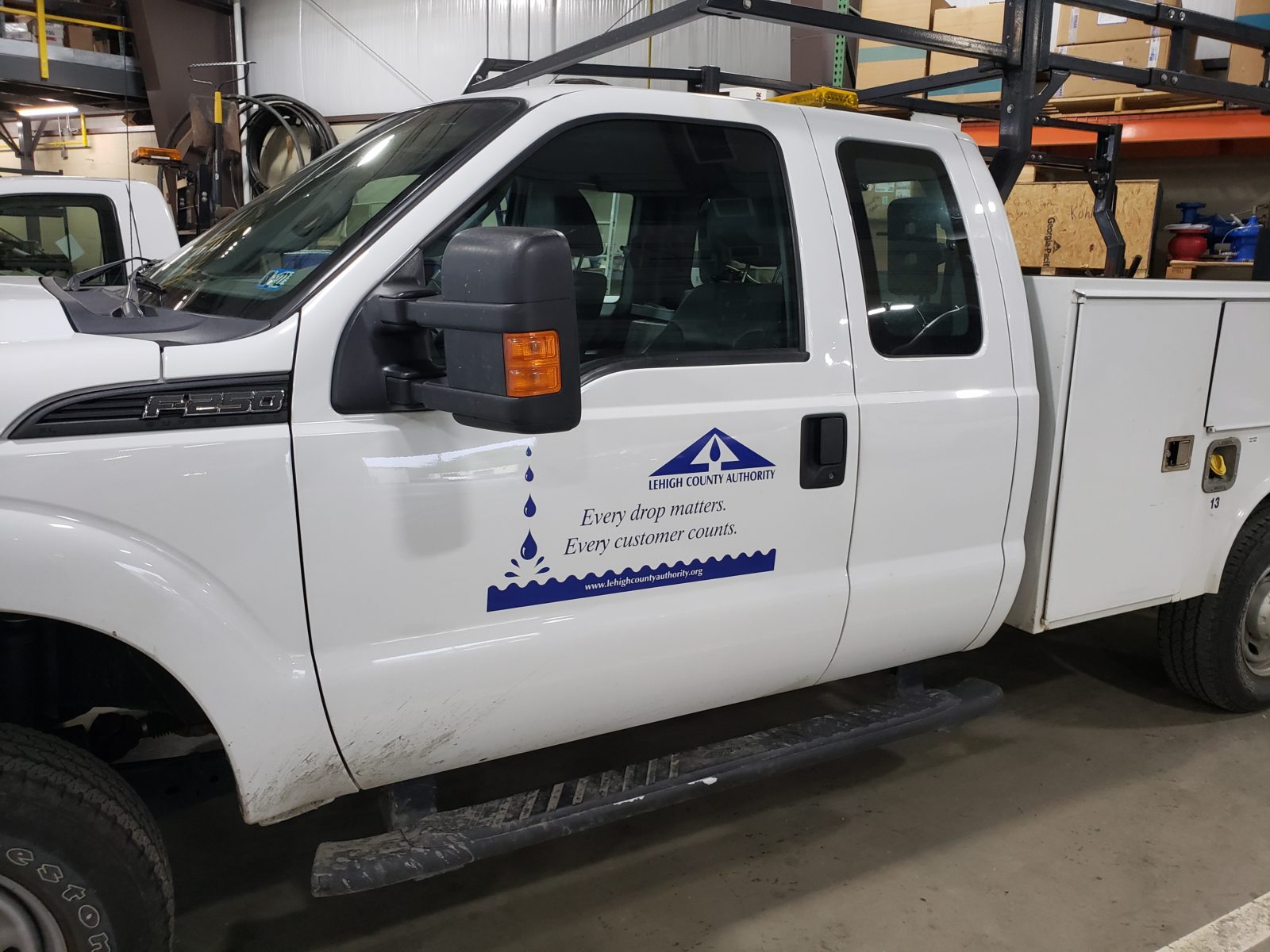 An image of a Lehigh County Authority work truck, clearly showing the LCA logo and motto, for a post on avoiding utility scams.