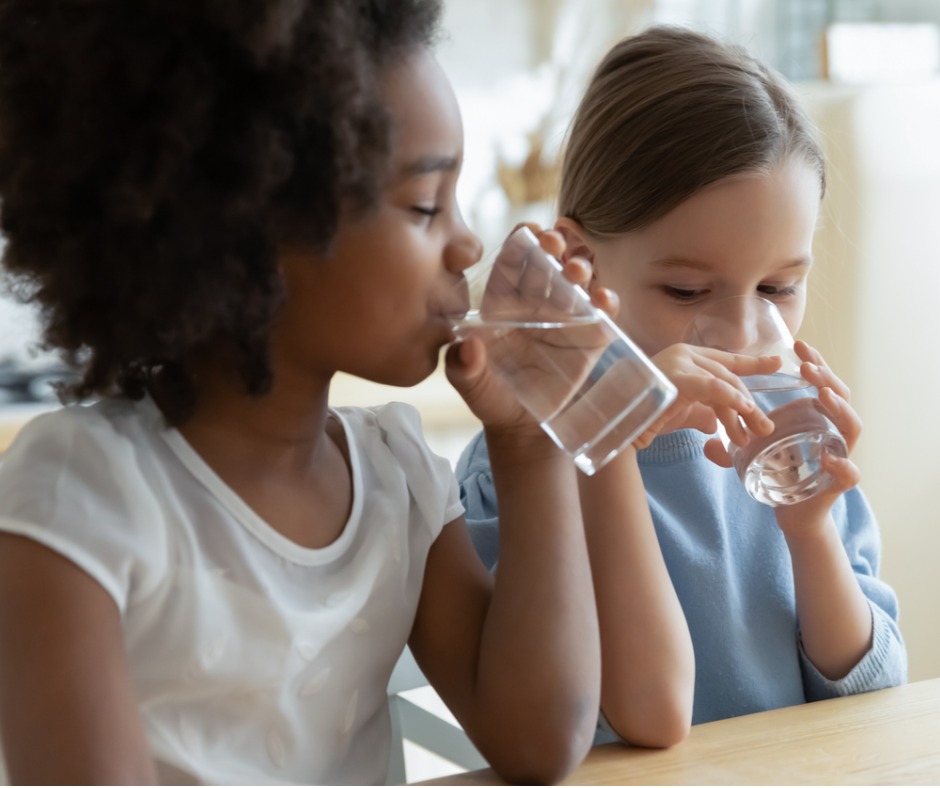 An image of two children drinking water to illustrate the importance of source water protection for National Prescription Drug Takeback Day.