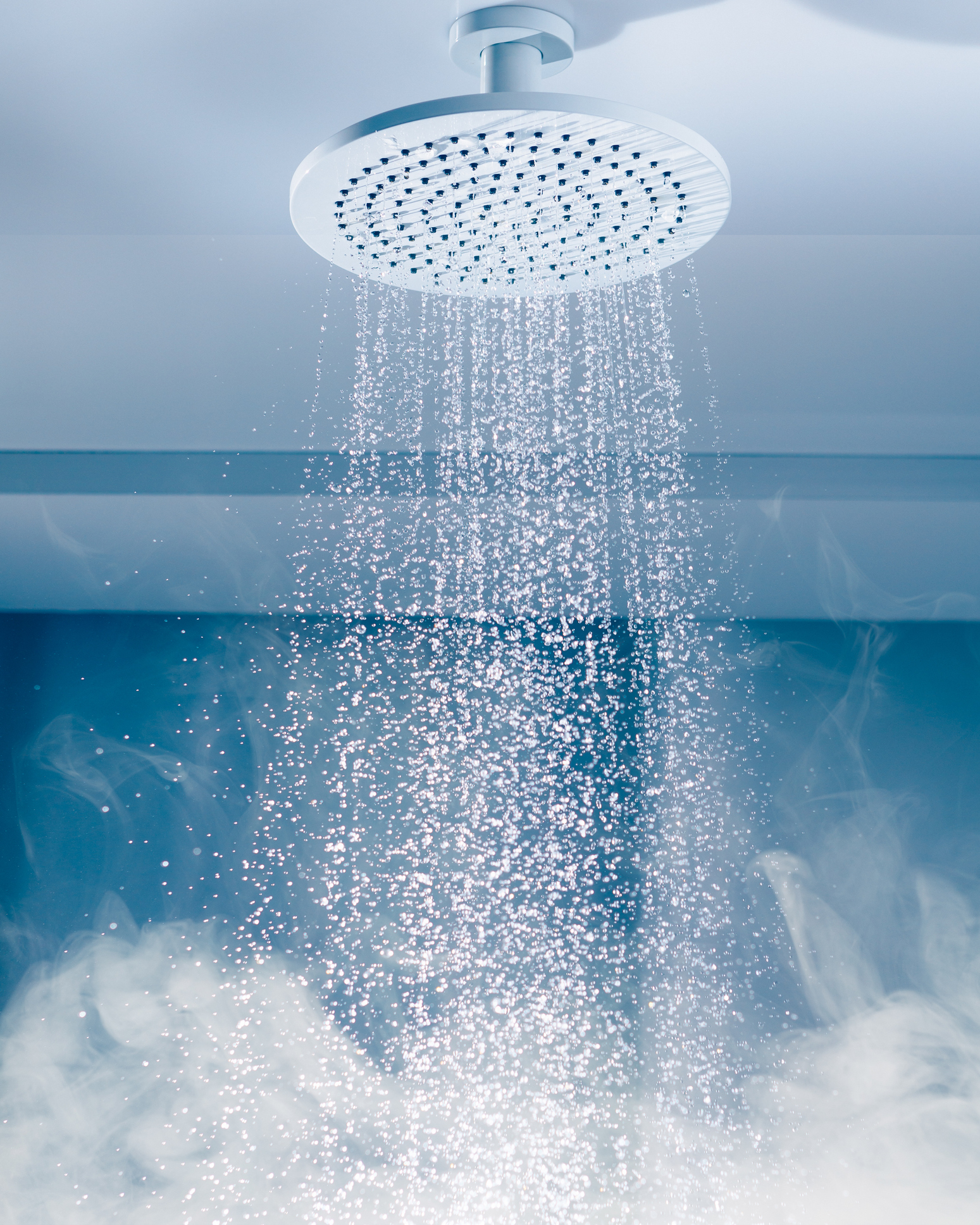 A showerhead with flowing water for an LCA post on saving water.