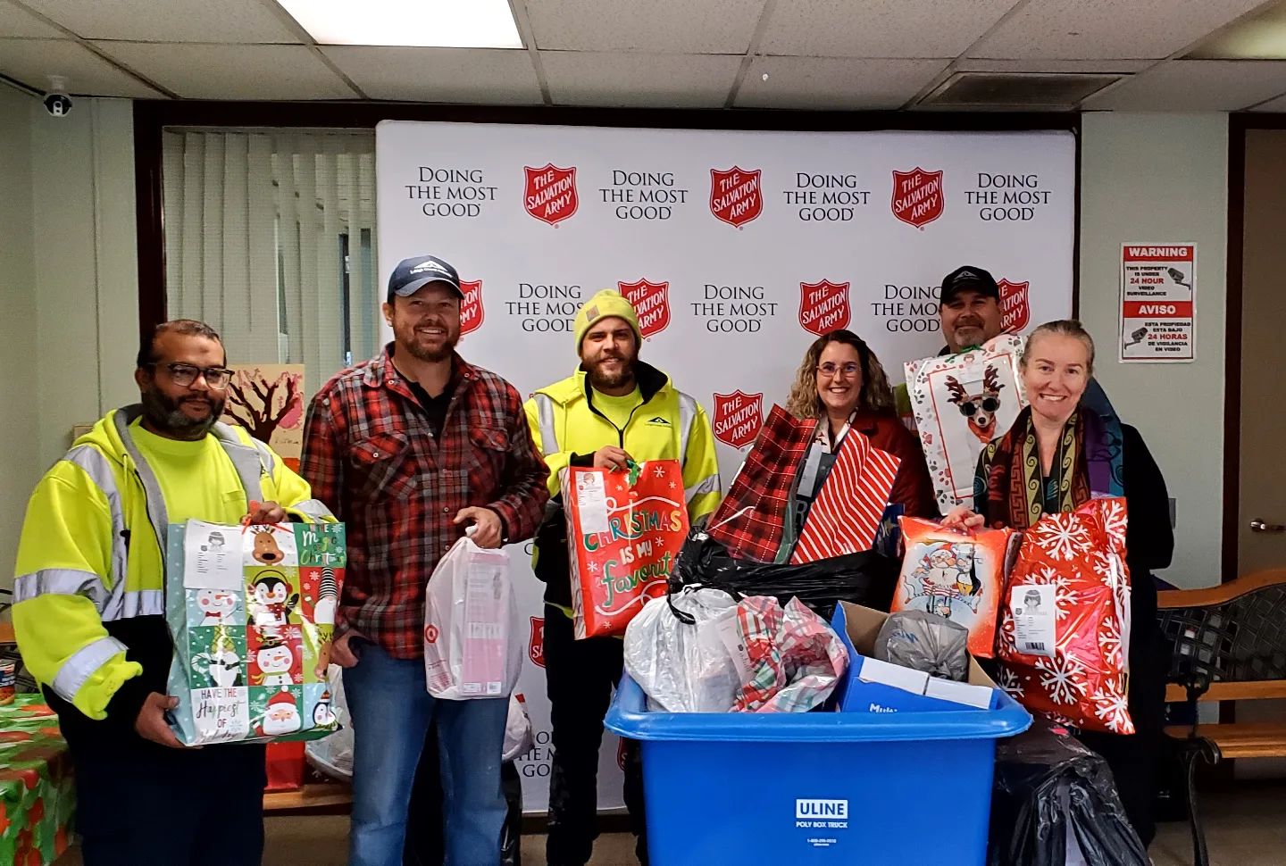 A picture of LCA workers delivering Christmas gifts through The Salvation Army's Angel Tree program for a blog post on the Angel Tree program.