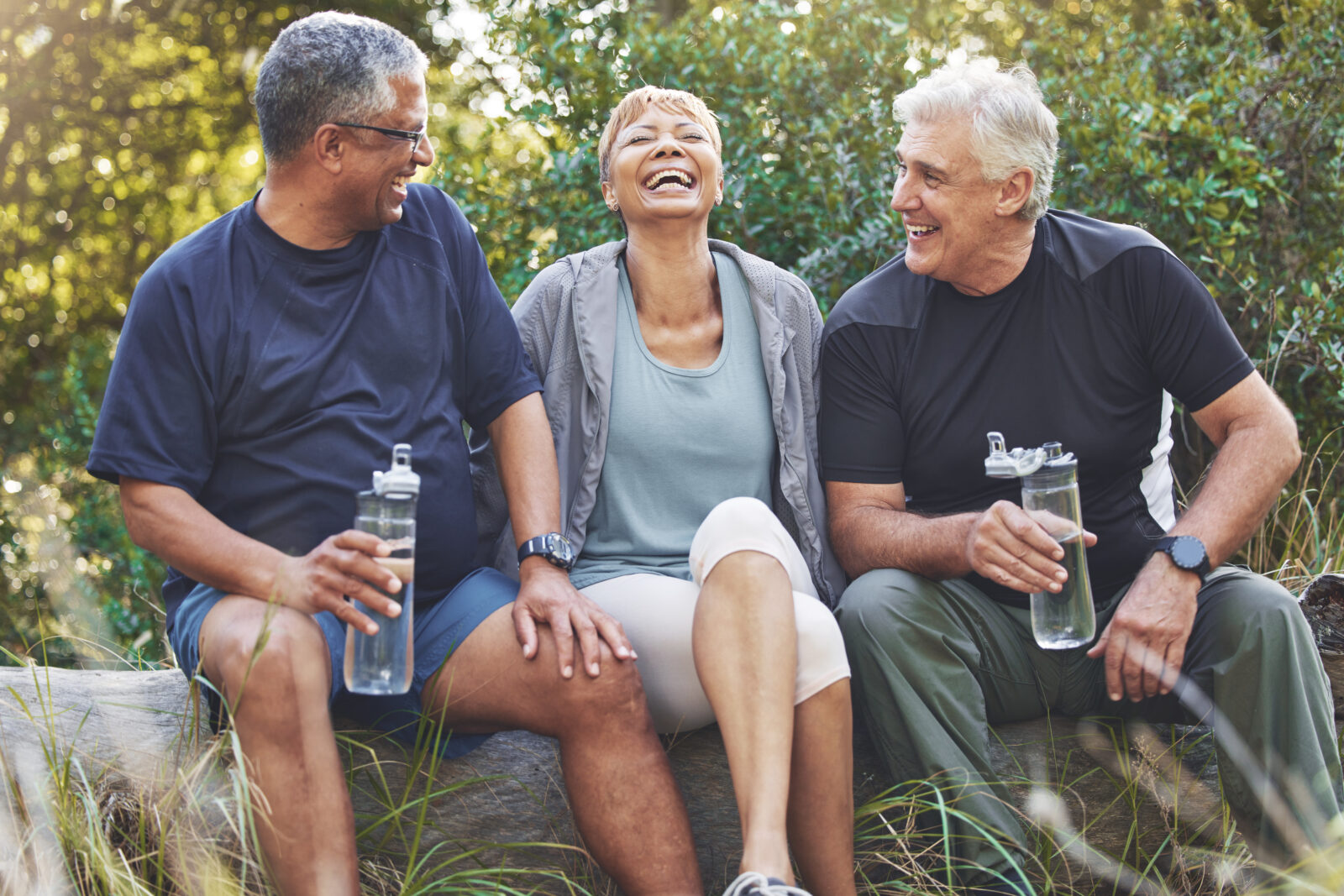 A picture of three older adults, laughing and taking a break from exercising and drinking water, to illustrate an LCA post on National Water Quality Month.